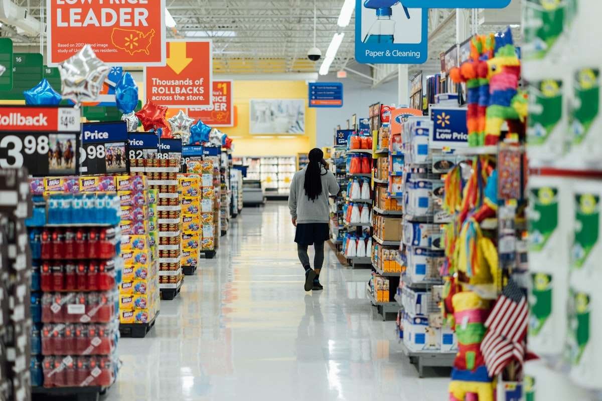 Crop dusting slang illustrated by a shopper walking away down a long store aisle