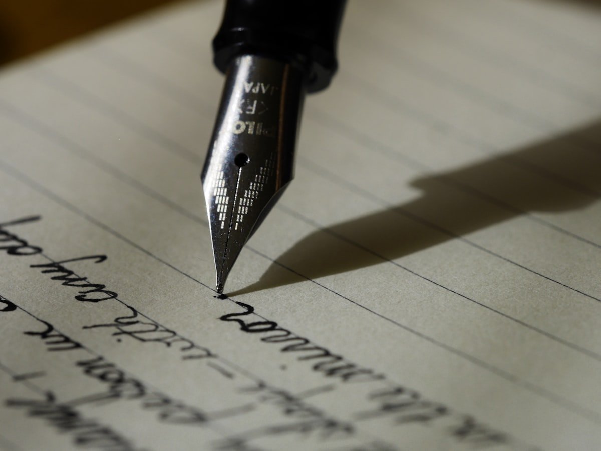 Does the comma go before or after but shown by a writer editing punctuation in a notebook draft